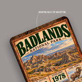 Close-up of the Badlands National Park aluminum sign showing pre-drilled mounting holes