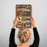 Pinnacles National Park facts sign hanging on a wall with vintage rock spire artwork