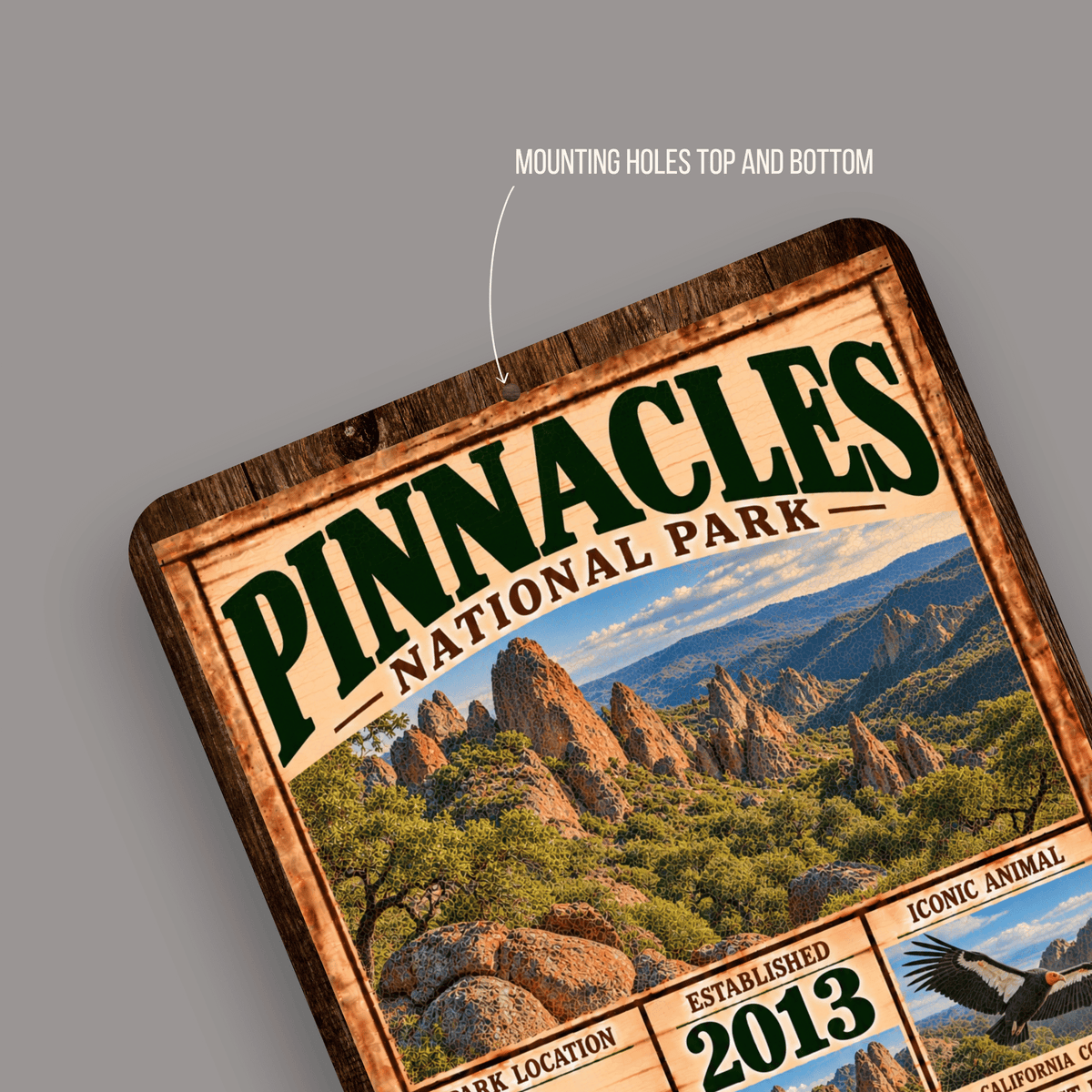 Close-up of rounded corners and predrilled mounting holes on the Pinnacles aluminum sign